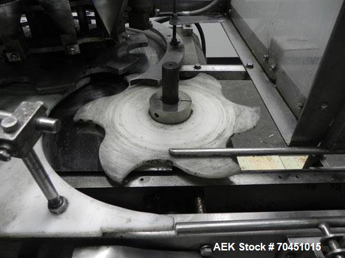 Used Anderson 8 Head Rotary Pump Placer and Crimper for fragrance, perfume and cologne. Aluminum body fragrance finger pump sprayers crimped to glass containers. Has PMC model MM36 valve stem sorter ...