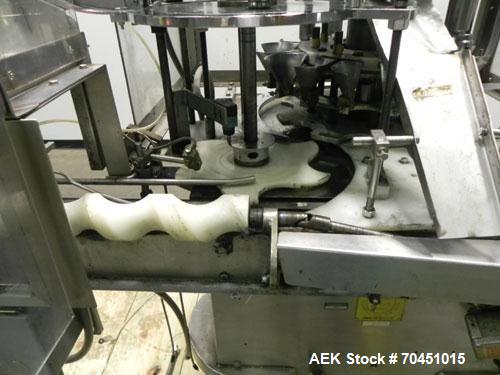 Used Anderson 8 Head Rotary Pump Placer and Crimper for fragrance, perfume and cologne. Aluminum body fragrance finger pump sprayers crimped to glass containers. Has PMC model MM36 valve stem sorter ...