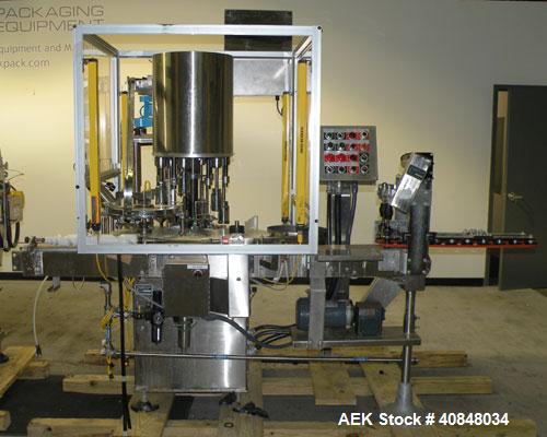 Used Anderson Machine Systems Six Spindle, Rotary Motion, Fully Automatic Pump Placing Machine. Designed to automatically sort pumps from random bulk form, apply them to bottles at speeds up to 100 p...