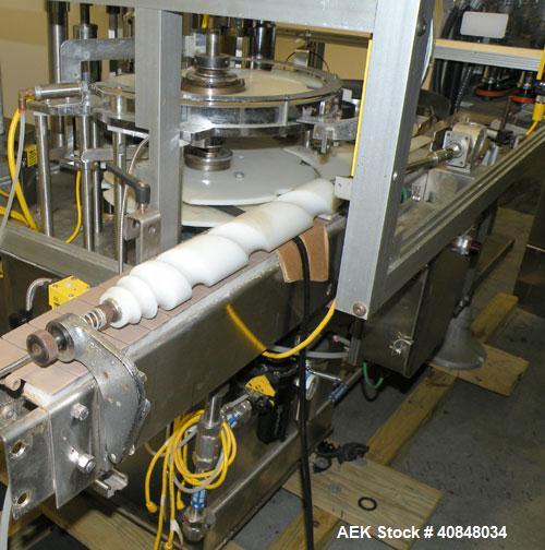 Used Anderson Machine Systems Six Spindle, Rotary Motion, Fully Automatic Pump Placing Machine. Designed to automatically sort pumps from random bulk form, apply them to bottles at speeds up to 100 p...