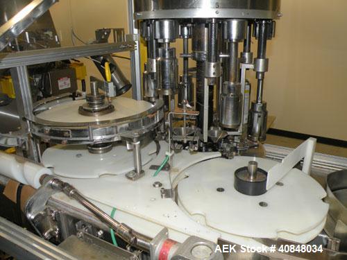 Used Anderson Machine Systems Six Spindle, Rotary Motion, Fully Automatic Pump Placing Machine. Designed to automatically sort pumps from random bulk form, apply them to bottles at speeds up to 100 p...