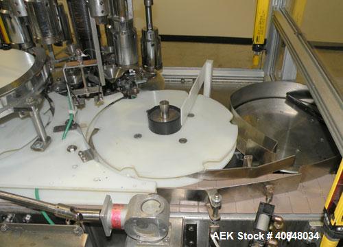 Used Anderson Machine Systems Six Spindle, Rotary Motion, Fully Automatic Pump Placing Machine. Designed to automatically sort pumps from random bulk form, apply them to bottles at speeds up to 100 p...