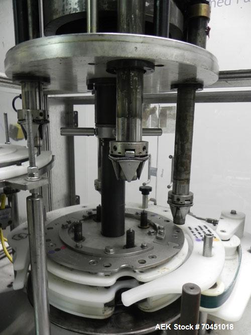 Used Anderson 4 head rotary pump/cap placer,withqty 2 Anderson cap /pump sorters and 1 and elevating feeder.