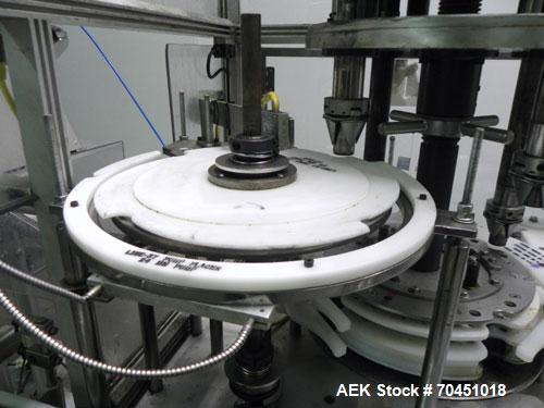 Used Anderson 4 head rotary pump/cap placer,withqty 2 Anderson cap /pump sorters and 1 and elevating feeder.