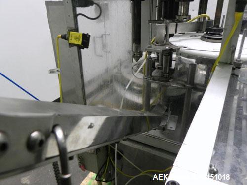 Used Anderson 4 head rotary pump/cap placer,withqty 2 Anderson cap /pump sorters and 1 and elevating feeder.