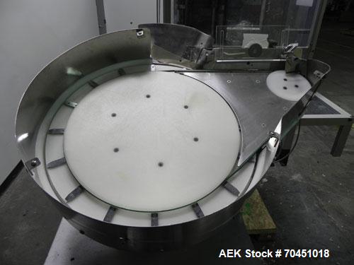 Used Anderson 4 head rotary pump/cap placer,withqty 2 Anderson cap /pump sorters and 1 and elevating feeder.