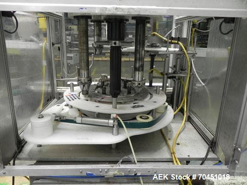 Used Anderson 4 head rotary pump/cap placer,withqty 2 Anderson cap /pump sorters and 1 and elevating feeder.