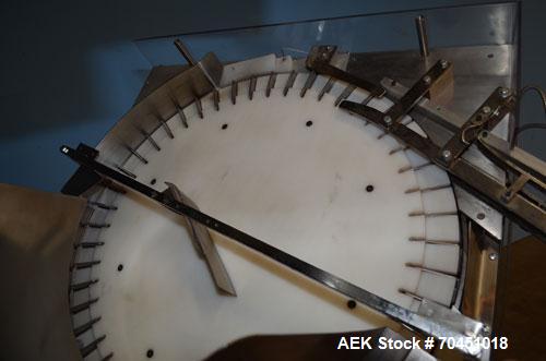 Used Anderson 4 head rotary pump/cap placer,withqty 2 Anderson cap /pump sorters and 1 and elevating feeder.