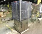Used Anderson Model C-800 8-Head Rotary Pump Placer and Crimper for fragrance, perfume and cologne. Aluminum body finger pump sprayers crimped to glass containers. Has PMC model MM36 valve stem sorte...