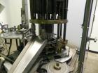 Used Anderson Model C-800 8-Head Rotary Pump Placer and Crimper for fragrance, perfume and cologne. Aluminum body finger pump sprayers crimped to glass containers. Has PMC model MM36 valve stem sorte...