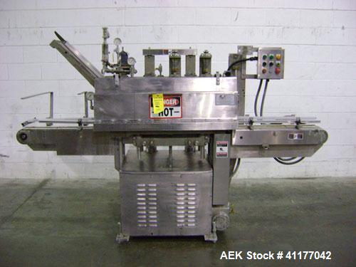 Used Diversified 76-450 Steam Capper designed to displace the air in the closure and head space of the container with steam. Automatically applies lug or PT style caps onto glass containers. Currentl...