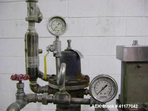 Used Diversified 76-450 Steam Capper designed to displace the air in the closure and head space of the container with steam. Automatically applies lug or PT style caps onto glass containers. Currentl...