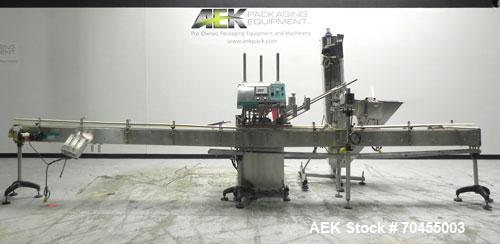 Used Inline Filling Systems inline belt capper with automatic cleated belt cap elevator. Capable of speeds up to 200 CPM (depending on cap size and container configuration). Has a container size rang...