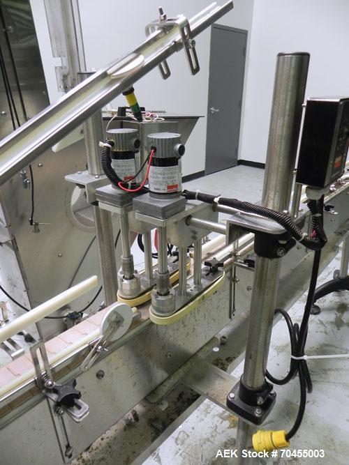 Used Inline Filling Systems inline belt capper with automatic cleated belt cap elevator. Capable of speeds up to 200 CPM (depending on cap size and container configuration). Has a container size rang...