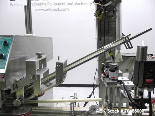 Used Inline Filling Systems inline belt capper with automatic cleated belt cap elevator. Capable of speeds up to 200 CPM (depending on cap size and container configuration). Has a container size rang...