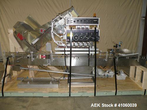 Used Kalish High Speed In Line Capper, 8 Quill, Model 5005, Stainless Steel. Last running 0 to 7-1/2" 946 ml bottles. Dual bottle feed belts. Includes a Kalish cap elevator, model 5650. Driven by a 1...