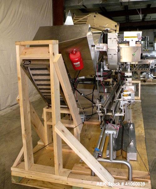 Used Kalish High Speed In Line Capper, 8 Quill, Model 5005, Stainless Steel. Last running 0 to 7-1/2" 946 ml bottles. Dual bottle feed belts. Includes a Kalish cap elevator, model 5650. Driven by a 1...