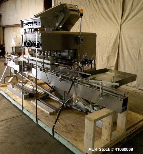 Used Kalish High Speed In Line Capper, 8 Quill, Model 5005, Stainless Steel. Last running 0 to 7-1/2" 946 ml bottles. Dual bottle feed belts. Includes a Kalish cap elevator, model 5650. Driven by a 1...