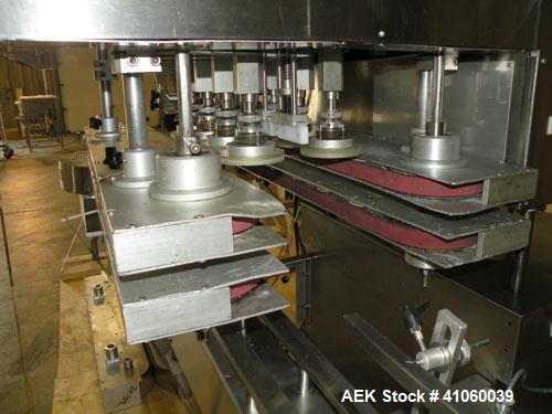 Used Kalish High Speed In Line Capper, 8 Quill, Model 5005, Stainless Steel. Last running 0 to 7-1/2" 946 ml bottles. Dual bottle feed belts. Includes a Kalish cap elevator, model 5650. Driven by a 1...