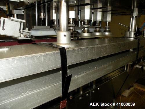 Used Kalish High Speed In Line Capper, 8 Quill, Model 5005, Stainless Steel. Last running 0 to 7-1/2" 946 ml bottles. Dual bottle feed belts. Includes a Kalish cap elevator, model 5650. Driven by a 1...