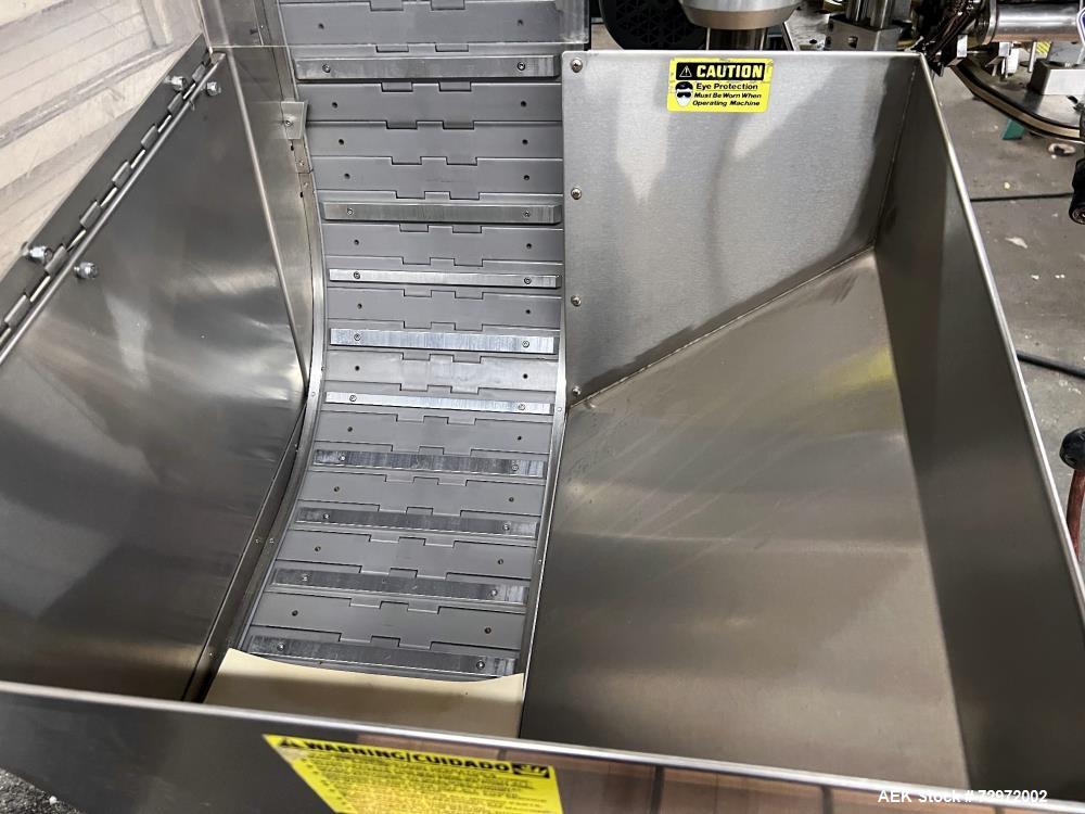 Used Kapsall Model A2 Inline Screw Capper. Capable of speeds up to 150 bottles per minute. Has single bottle grippers, three pair spindles  with adjustable cap chute and integrated cap elevator. Cap ...