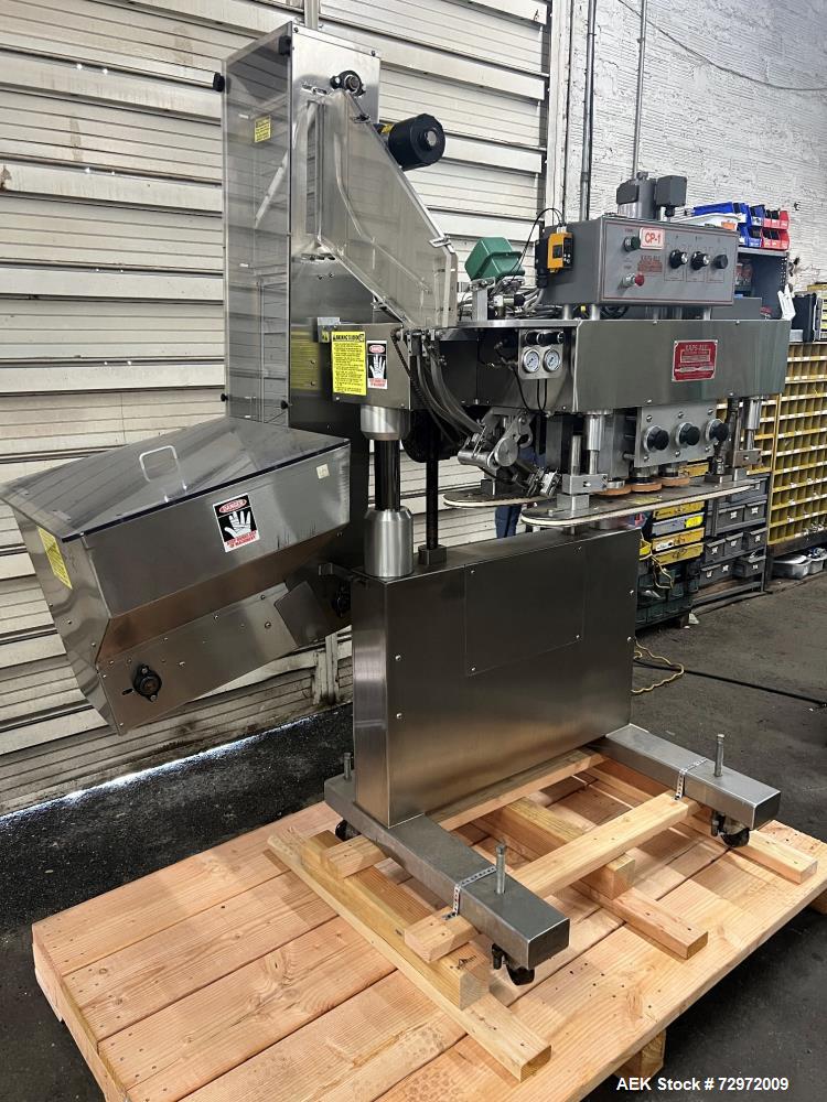 Used Kapsall Model A 2Inline Screw Capper. Capable of speeds up to 150 bottles per minute. Has single bottle grippers, three pair spindles  with adjustable cap chute and integrated cap elevator. Cap ...