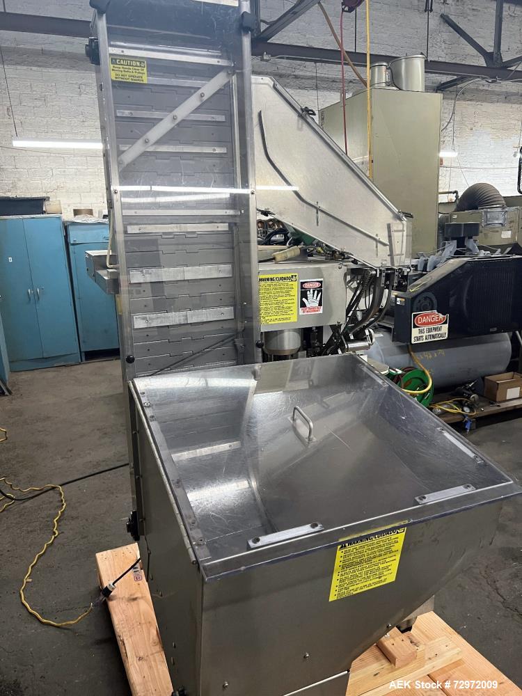Used Kapsall Model A 2Inline Screw Capper. Capable of speeds up to 150 bottles per minute. Has single bottle grippers, three pair spindles  with adjustable cap chute and integrated cap elevator. Cap ...