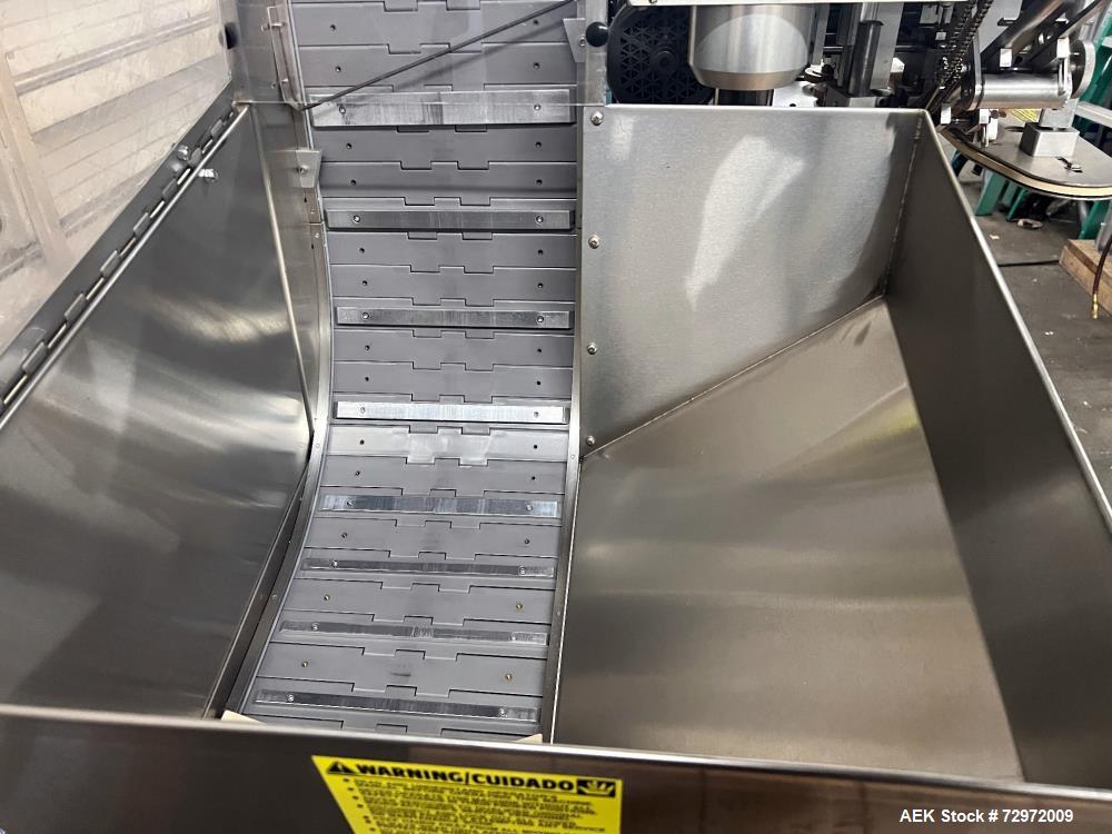 Used Kapsall Model A 2Inline Screw Capper. Capable of speeds up to 150 bottles per minute. Has single bottle grippers, three pair spindles  with adjustable cap chute and integrated cap elevator. Cap ...