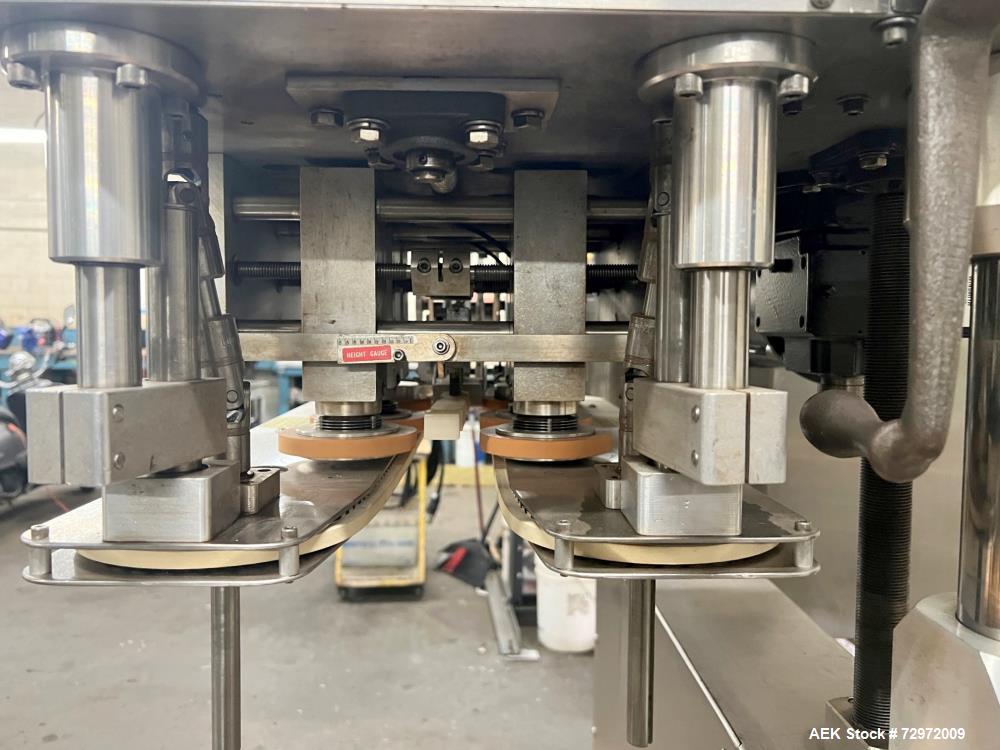 Used Kapsall Model A 2Inline Screw Capper. Capable of speeds up to 150 bottles per minute. Has single bottle grippers, three pair spindles  with adjustable cap chute and integrated cap elevator. Cap ...