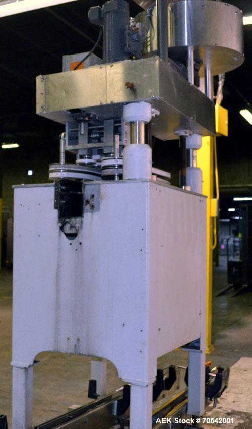 Used Kapsall Model A Inline Screw Capper. Capable of speeds up to 200 bottles per minute. Has dual bottle grippers, three pair spindles and 24" dia centrifigal cap sorter with adjustable cap chute. C...