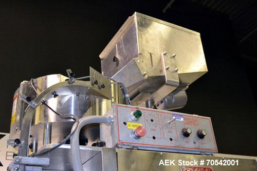 Used Kapsall Model A Inline Screw Capper. Capable of speeds up to 200 bottles per minute. Has dual bottle grippers, three pair spindles and 24" dia centrifigal cap sorter with adjustable cap chute. C...