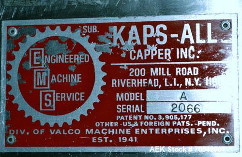 Used Kapsall Model A Inline Screw Capper. Capable of speeds up to 200 bottles per minute. Has dual bottle grippers, three pair spindles and 24" dia centrifigal cap sorter with adjustable cap chute. C...