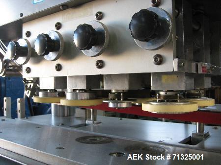 Used KapsAll, Model C-8, Automatic (8) Spindle Capper. Single belt container gripper. Manufacture stated cap size range 8mm-120mm (with proper change parts).