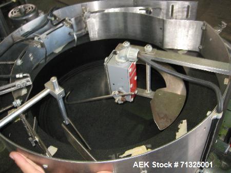 Used KapsAll, Model C-8, Automatic (8) Spindle Capper. Single belt container gripper. Manufacture stated cap size range 8mm-120mm (with proper change parts).