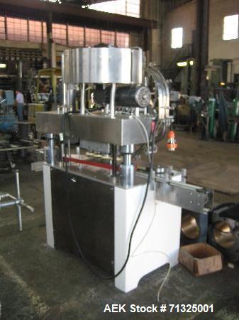 Used KapsAll, Model C-8, Automatic (8) Spindle Capper. Single belt container gripper. Manufacture stated cap size range 8mm-120mm (with proper change parts).