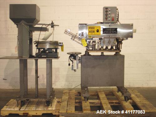 Used SureKap 3 Spindle Quill Capper, Model SK6000-SP18M. Adjustable chute will handle caps from 13 to 110mm without change parts. Has dual gripper belts, C frame construction will mount up to any con...