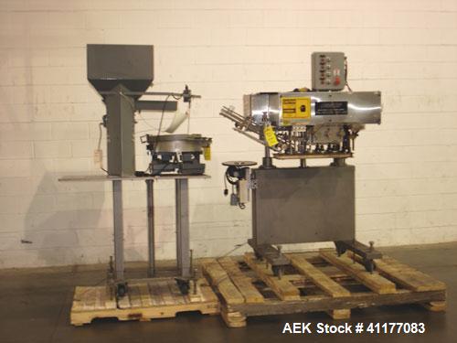 Used SureKap 3 Spindle Quill Capper, Model SK6000-SP18M. Adjustable chute will handle caps from 13 to 110mm without change parts. Has dual gripper belts, C frame construction will mount up to any con...