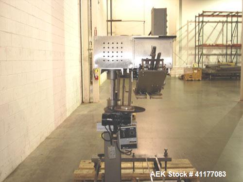 Used SureKap 3 Spindle Quill Capper, Model SK6000-SP18M. Adjustable chute will handle caps from 13 to 110mm without change parts. Has dual gripper belts, C frame construction will mount up to any con...