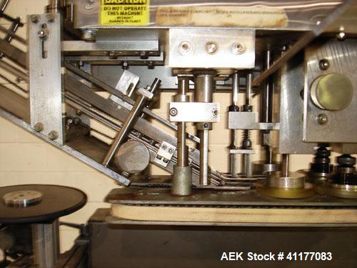 Used SureKap 3 Spindle Quill Capper, Model SK6000-SP18M. Adjustable chute will handle caps from 13 to 110mm without change parts. Has dual gripper belts, C frame construction will mount up to any con...