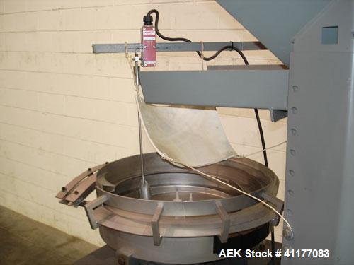 Used SureKap 3 Spindle Quill Capper, Model SK6000-SP18M. Adjustable chute will handle caps from 13 to 110mm without change parts. Has dual gripper belts, C frame construction will mount up to any con...