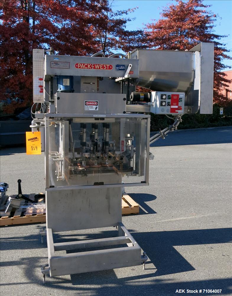 Used Pack West Model Auto 120 capper capable of speeds from 80 - 150 caps per minute. Cap size range: 10mm - 120mm with changeparts.  In-Line Cappe, 6 Quill capper, dual gripper belt, gripper speed c...