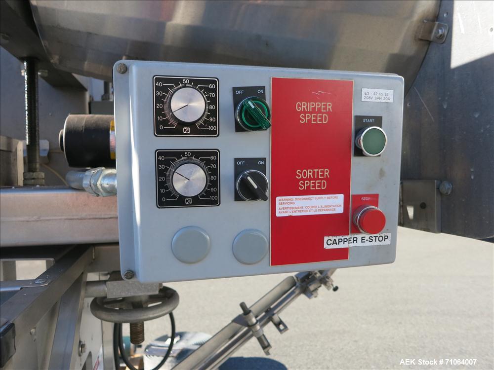 Used Pack West Model Auto 120 capper capable of speeds from 80 - 150 caps per minute. Cap size range: 10mm - 120mm with changeparts.  In-Line Cappe, 6 Quill capper, dual gripper belt, gripper speed c...