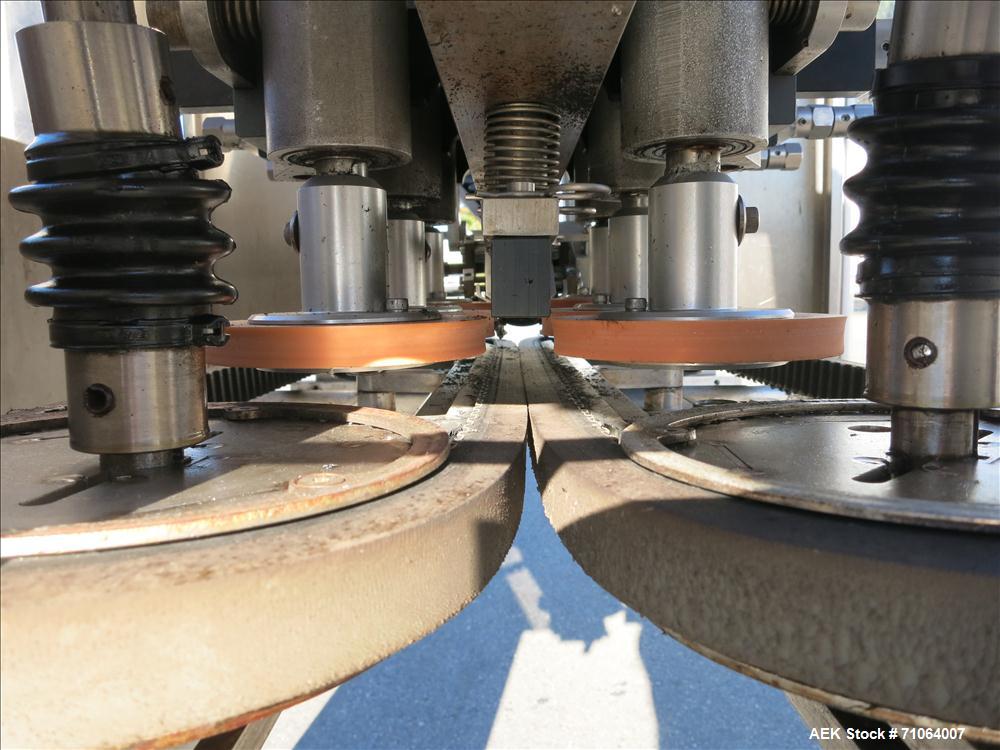 Used Pack West Model Auto 120 capper capable of speeds from 80 - 150 caps per minute. Cap size range: 10mm - 120mm with changeparts.  In-Line Cappe, 6 Quill capper, dual gripper belt, gripper speed c...
