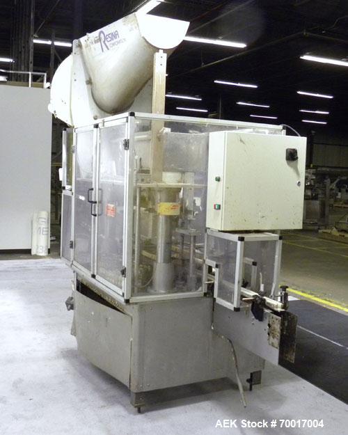 Used Resina In-Line Quill Style Capper, Model NRU-301417. (3) Sets of 2 quills, rates up to approximately 300 caps per minute. Adjustable from 10-70mm caps depending on change parts. Includes a pin s...