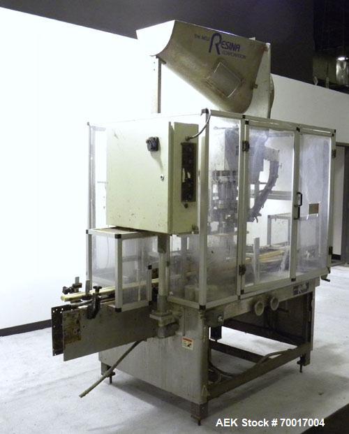 Used Resina In-Line Quill Style Capper, Model NRU-301417. (3) Sets of 2 quills, rates up to approximately 300 caps per minute. Adjustable from 10-70mm caps depending on change parts. Includes a pin s...