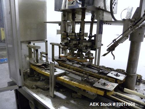 Used Resina In-Line Quill Style Capper, Model NRU-301417. (3) Sets of 2 quills, rates up to approximately 300 caps per minute. Adjustable from 10-70mm caps depending on change parts. Includes a pin s...