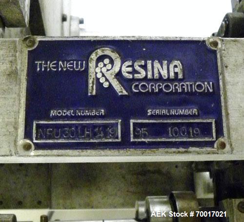 Used Resina In-Line Quill Style Capper, Model NRU-30LH49. (3) Sets of 2 quills, rates up to approximately 300 caps per minute. Adjustable from 10-70mm caps depending on change parts. Includes a pin s...