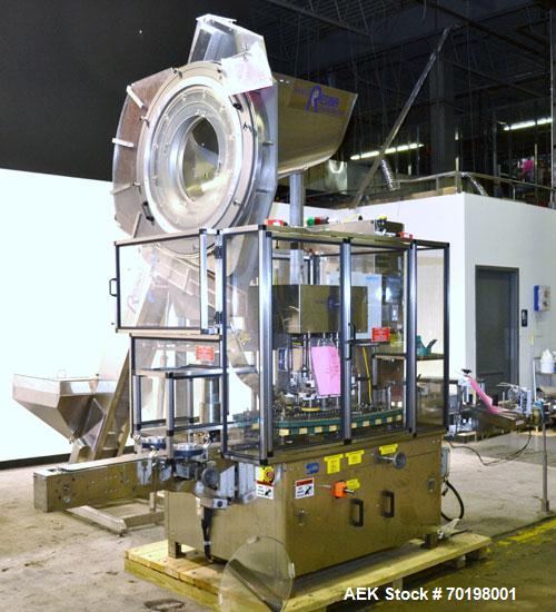Used Resina Model NRU51 High Speed Automatic Inline Quill Capper. Machine is capable of speeds up to 300 bpm. Cap size range: 10mm to 89mm with changeparts. Equipped with dual belt gripper, H26 exten...