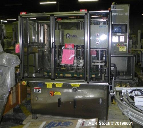 Used Resina Model NRU51 High Speed Automatic Inline Quill Capper. Machine is capable of speeds up to 300 bpm. Cap size range: 10mm to 89mm with changeparts. Equipped with dual belt gripper, H26 exten...