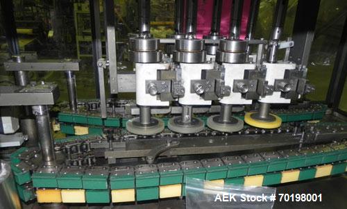 Used Resina Model NRU51 High Speed Automatic Inline Quill Capper. Machine is capable of speeds up to 300 bpm. Cap size range: 10mm to 89mm with changeparts. Equipped with dual belt gripper, H26 exten...